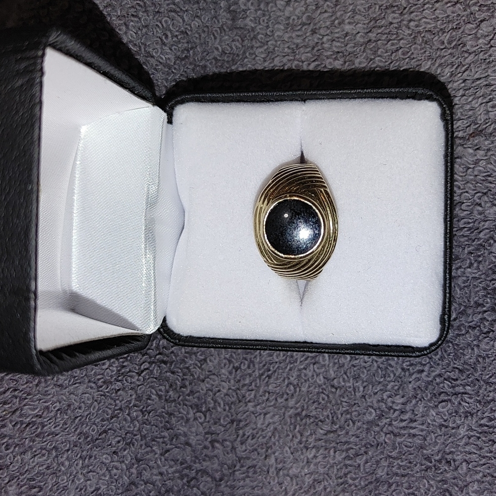 Mens 14kt. Onyx and 14 kt. Gold pinky ring.